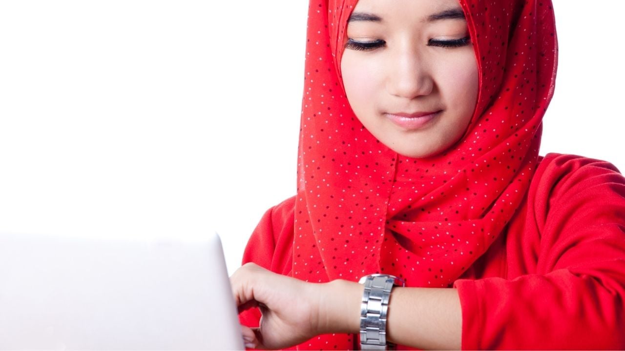 hijab woman looking at watch